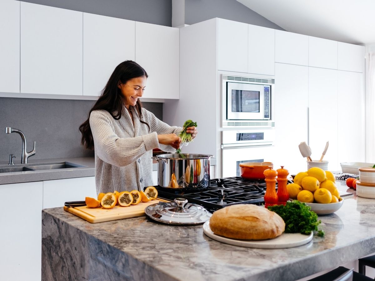 Woman smiling cooking