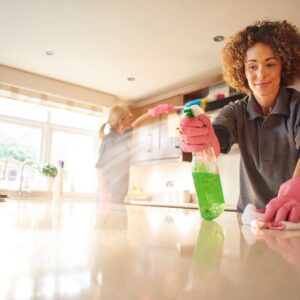 House cleaners cleaning a kitchen.