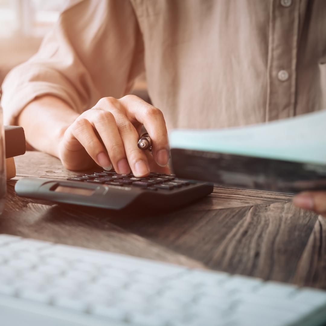 woman using calculator