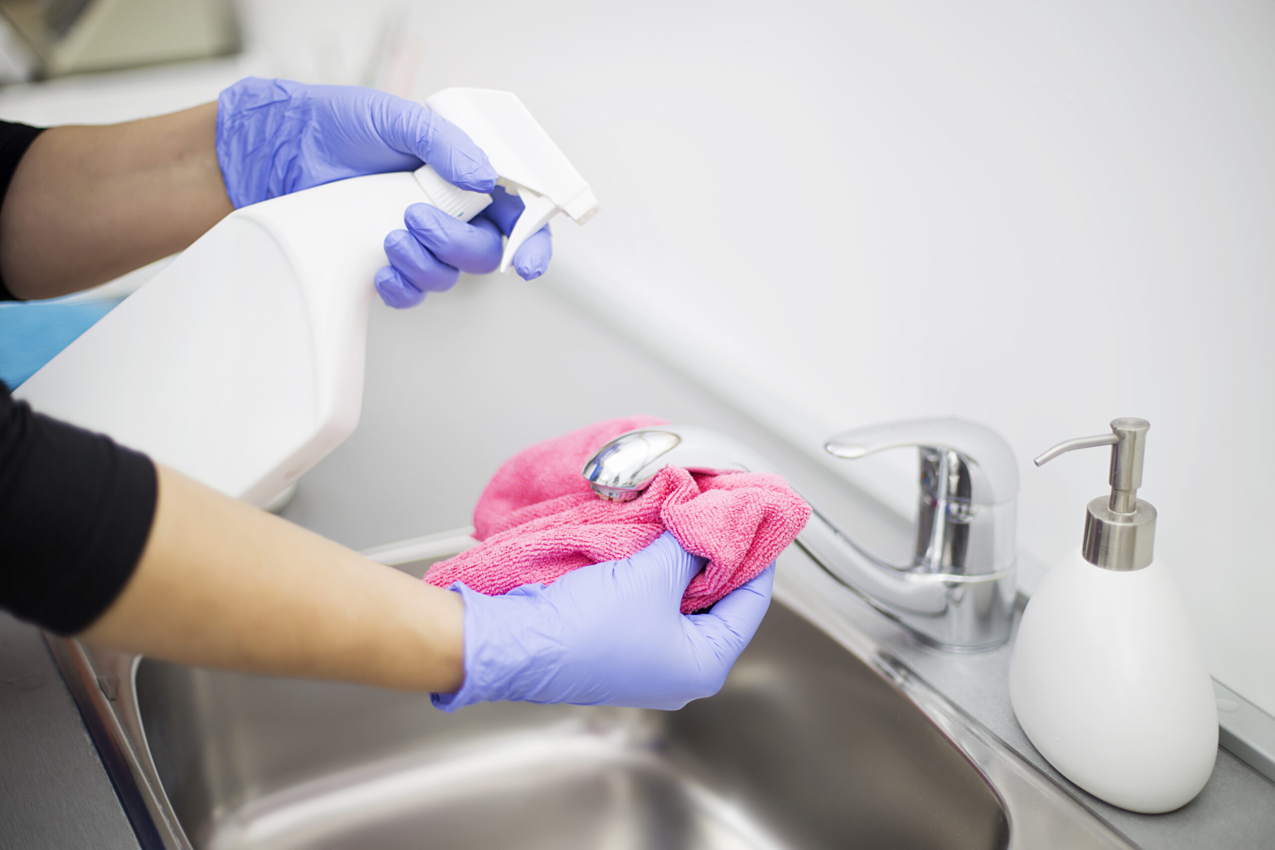 Woman at work, professional maid cleaning in office against virus desease